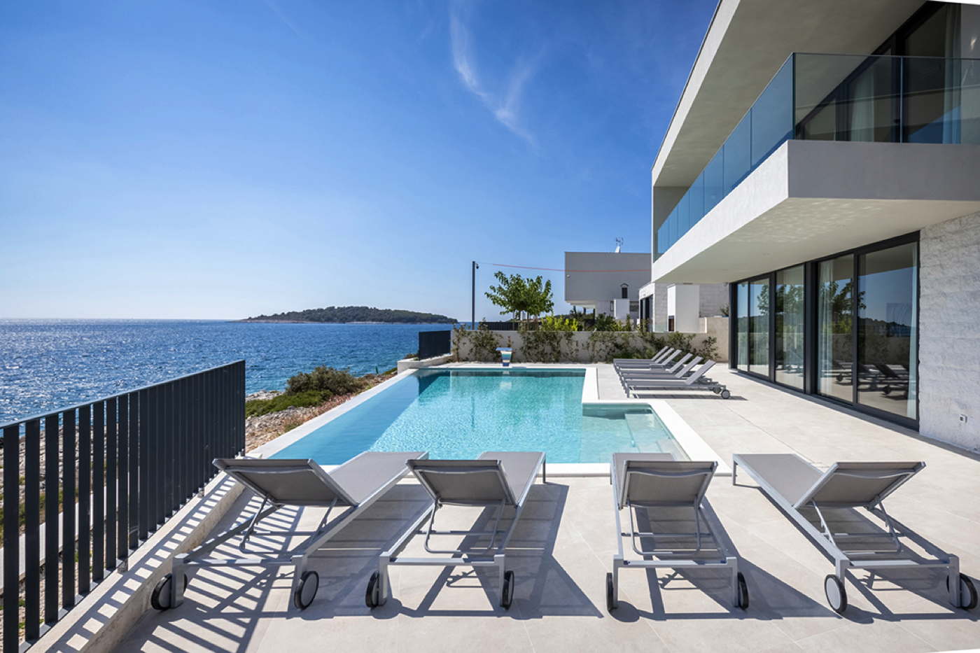 Beachfront holiday villa private pool at rocky beach Dalmatia Croatia